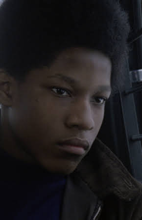 Alrick Riley as Director