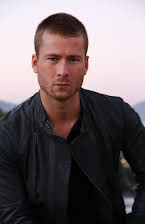 Glen Powell as 
