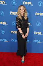 Minkie Spiro as Director