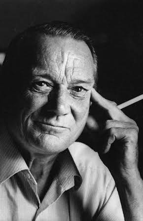 Denholm Elliot as 
