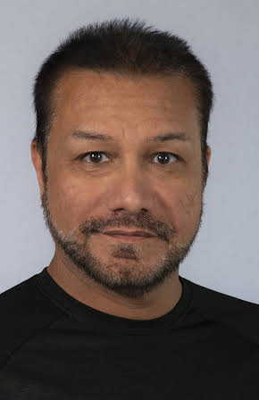 Amir Valinia as Director