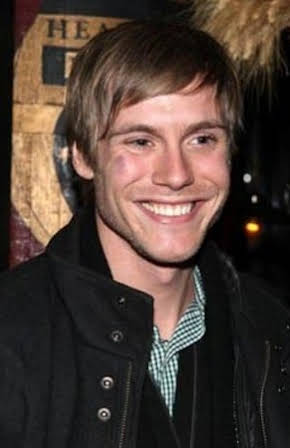 Zachary Booth as 