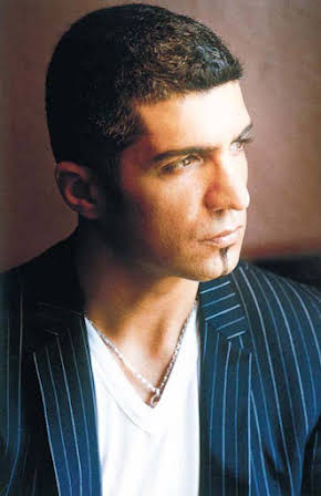 Özcan Deniz as Director