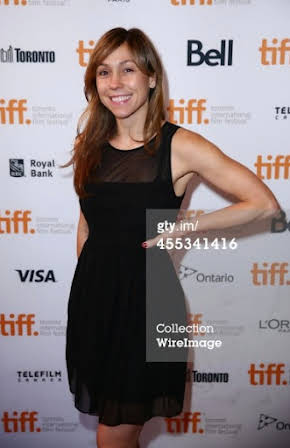 Katie Mustard as Director
