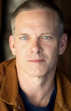 Adam John Harrington as 