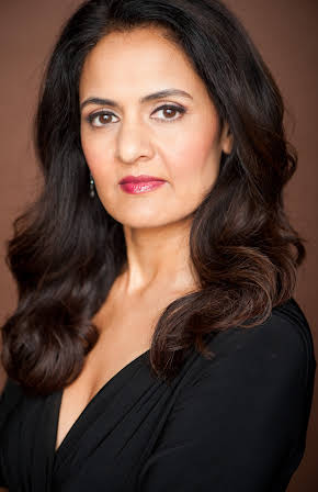 Gita Reddy as The Guru