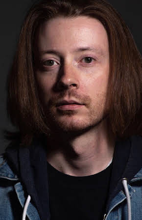 Adrian Bond as 