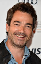 Jon Tenney as 