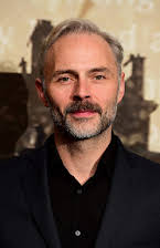 Mark Bonnar as 