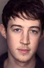 Alex Sharp as 