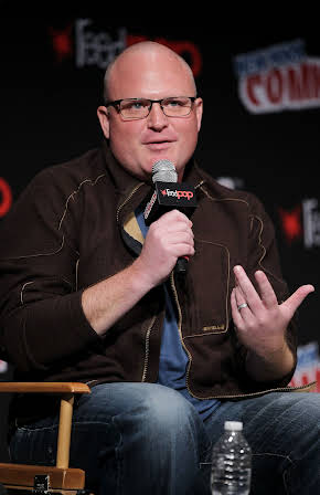 Derek Kolstad as Director