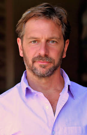 Ben Bode as Tom Marlowe, Helicopter Pilot