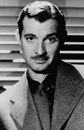 Zachary Scott as 