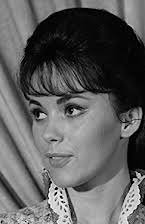 Lory Patrick como Tina 
  
  
  (archive footage)