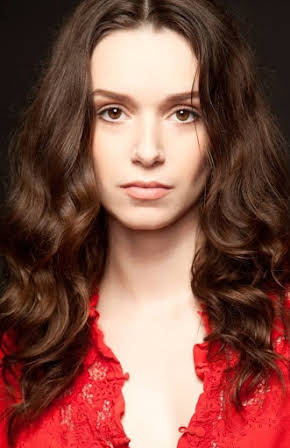 Alex Essoe as April