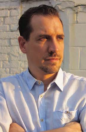 Shan Nicholson as Director