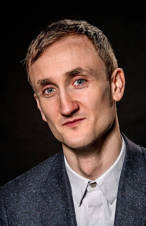Tom Brooke as 