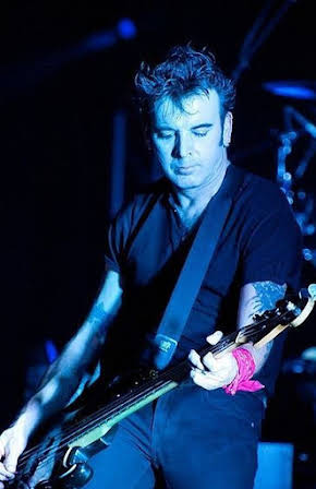 Simon Gallup as 