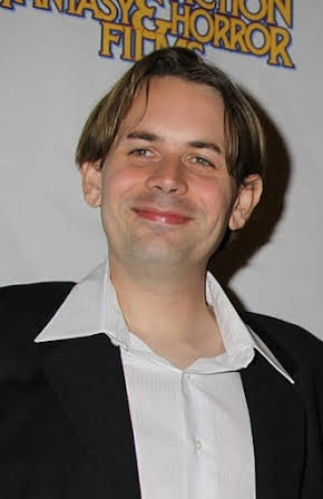 Andrew Kasch as Director