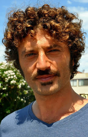 Guido Caprino as 