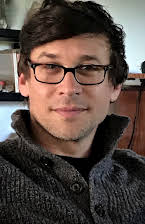 Yaniv Raz as Director