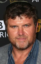 Sam Miller som Director