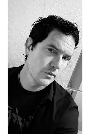 John Maringouin as Director