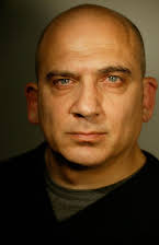 Jonny Coyne as Pawn Shop Owner