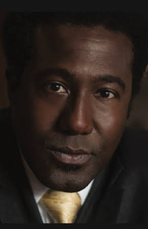 E. Roger Mitchell as 