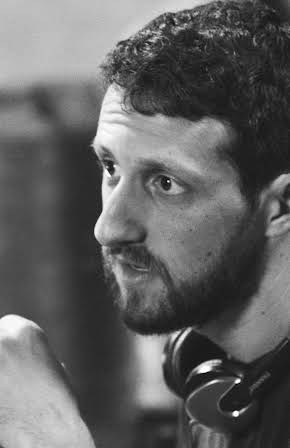 Max Isaacson as Director