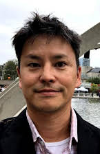 Russ Riggins som Director