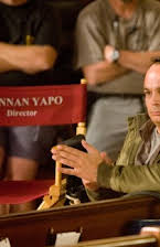 Mennan Yapo as Director