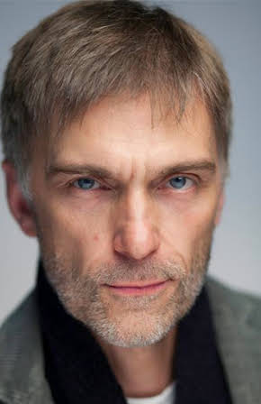 James Simmons as Director