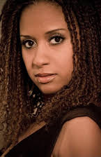 Tracie Thoms als 