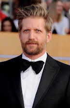 Paul Sparks como 