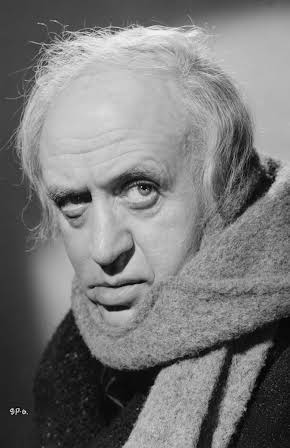 Alastair Sim as 
