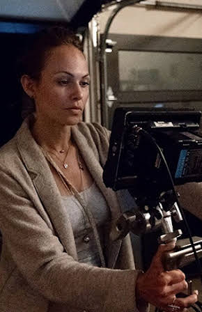 Paula Elle as Director