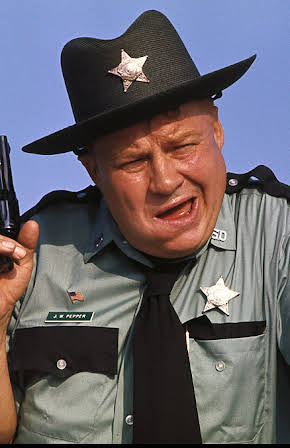 Clifton James as Tuttle