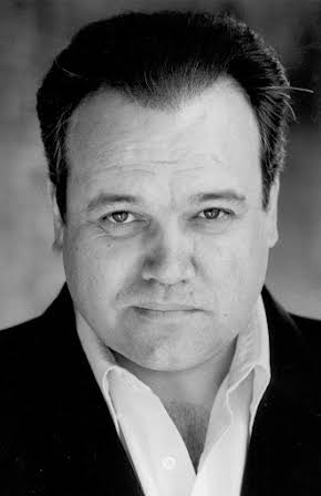 Shaun Williamson as 