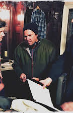 E.B. Hughes as Director