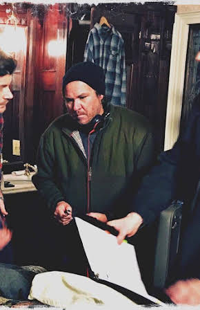 E.B. Hughes as Director