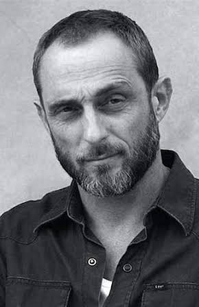 Roland Møller as 