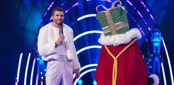 Joel Dommett Throws The Masked Singer Christmas Special Into Chaos After Accidental Celebrity Reveal