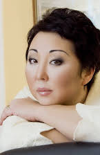 Aliya Uvalzhanova as Director