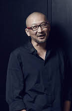 Hu Guan as Director