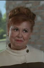 Sandra Gould as Director