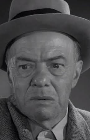 Russell Collins as 
