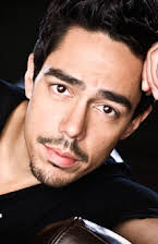Zak Santiago as 