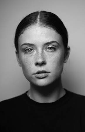 Mia Tomlinson as 