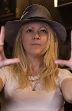 Jamielyn Lippman como Director